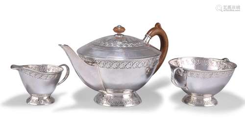 AN ARTS AND CRAFTS SILVER THREE-PIECE TEA SERVICE, by Willia...