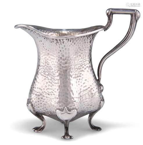 AN ARTS AND CRAFTS SILVER CREAM JUG, by Edward Souter Barnsl...