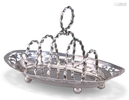 AN EDWARDIAN SILVER TOAST RACK, by Thomas Levesley, Sheffiel...