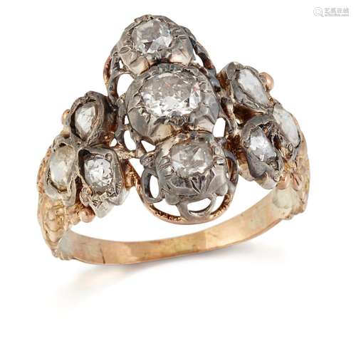 A DIAMOND CLUSTER RING, three old-cut diamonds between group...