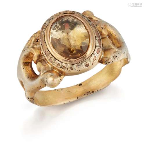 A CITRINE RING, an oval-cut citrine in a closed setting, to ...