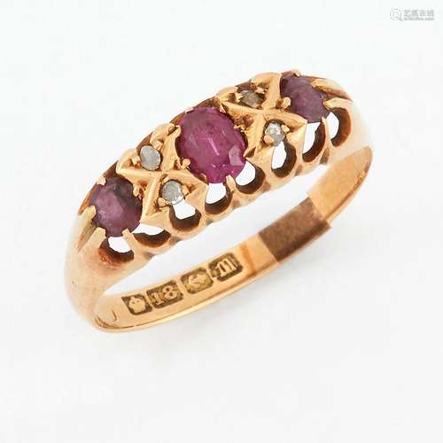 AN 18 CARAT GOLD RUBY AND DIAMOND RING, three graduated oval...