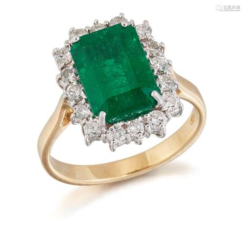 AN 18 CARAT GOLD EMERALD AND DIAMOND CLUSTER RING, an octago...