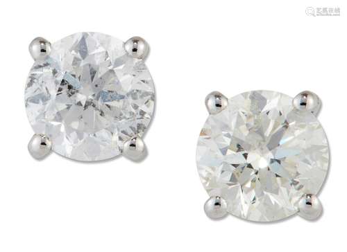 A PAIR OF SOLITAIRE DIAMOND EARRINGS, round brilliant-cut di...