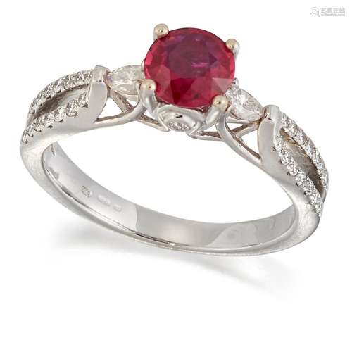 AN 18 CARAT WHITE GOLD RUBY AND DIAMOND RING, a round-cut ru...