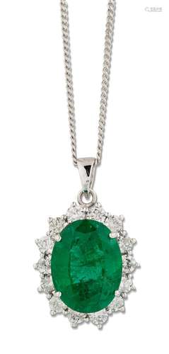 AN 18 CARAT WHITE GOLD EMERALD AND DIAMOND CLUSTER PENDANT O...