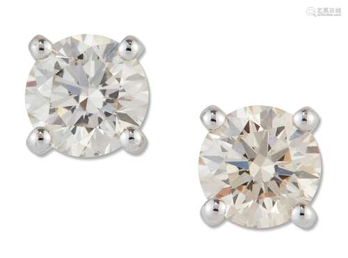 A PAIR OF SOLITAIRE DIAMOND EARRINGS, round brilliant-cut di...