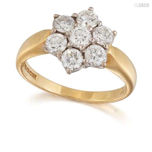 AN 18 CARAT GOLD DIAMOND CLUSTER RING, seven round brilliant...