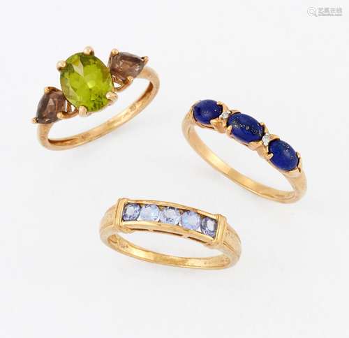 THREE 9 CARAT GOLD GEM-SET RINGS, including A PERIDOT AND SM...