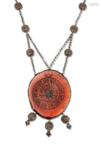 A CARNELIAN ISLAMIC VERSE PENDANT NECKLACE, the large oval a...