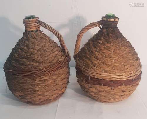 LOT OF 2 HANDBLOWN GLASS VESSELS IN WICKER CRADLES