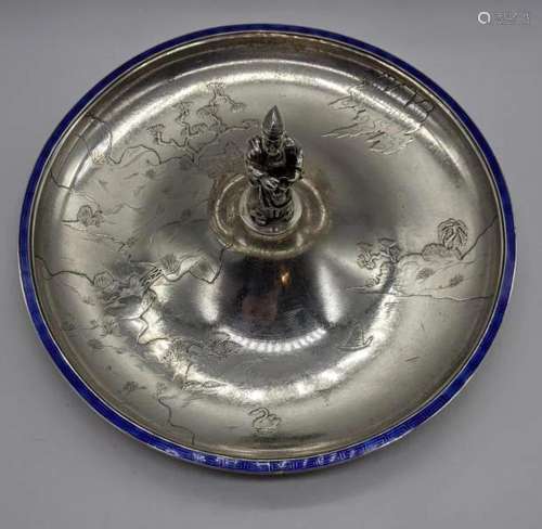 A Japanese silver dish depicting landscape scenes,