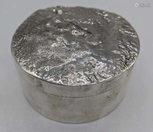 A silver round box with marbled top, hallmarked,