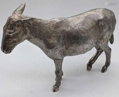 A silver cast sculpture of a donkey, hallmarked London