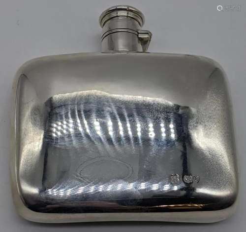 A late Victorian silver hip flask, hallmarked London,
