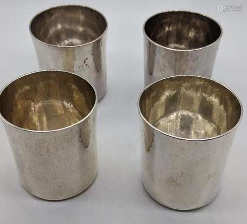 A set of 4 Arts and Crafts 20th century silver beakers,