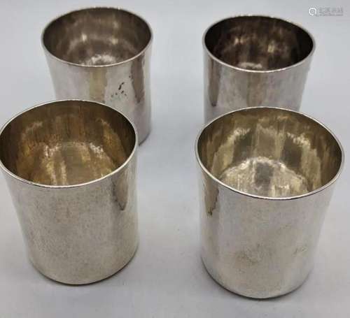 A set of 4 Arts and Crafts 20th century silver beakers,