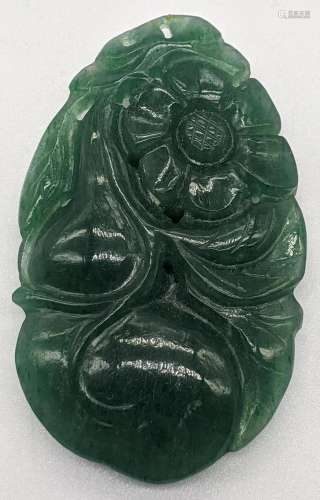 A Chinese green jade carving of flowers and fruit,