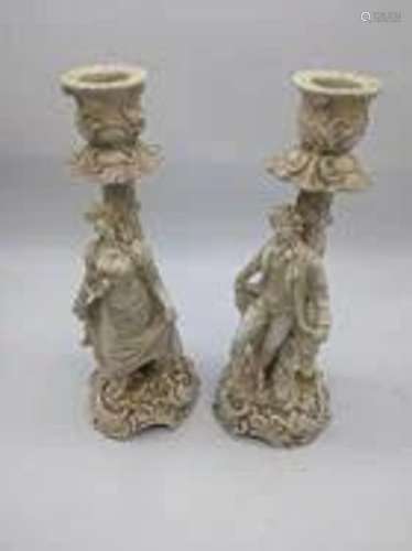 A pair of 19th century German porcelain candlesticks,