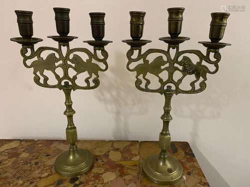 A pair of Lion of Judah brass candelabra