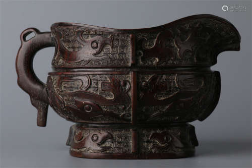 A Narra Wood Pot with Taotie Design.