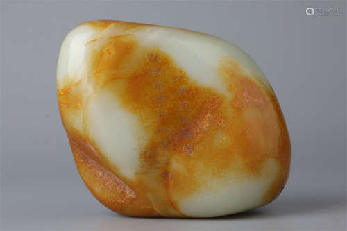 A Hetian Raw Jade with Carved Poem Design.