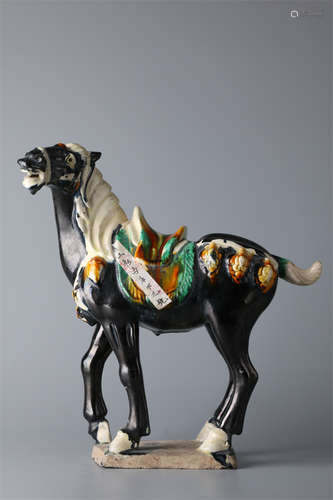 A Tang-Dynasty Three-Color Steed Sculpture.