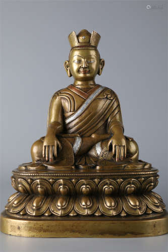 A Copper Guru Buddha Statue.