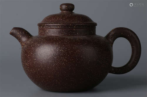 A Purple Clay Teapot.