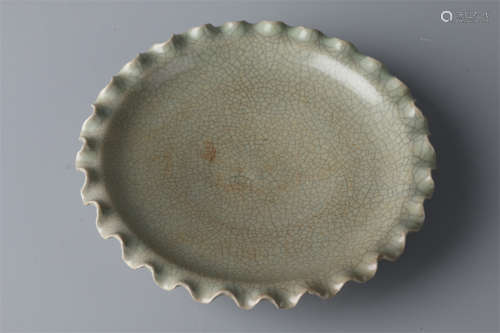 A Porcelain Plate with Flower Shaped Rim.