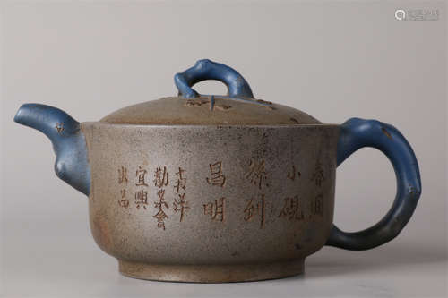 A Purple Clay Teapot with Poems Design.