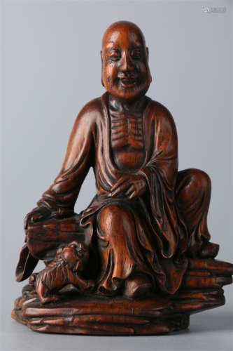 A Huanghuali Wood Arhat Statue.