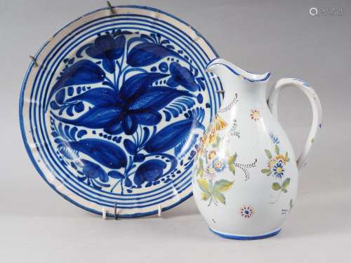 A Continental faience dish with blue flower decoration, 12 d...