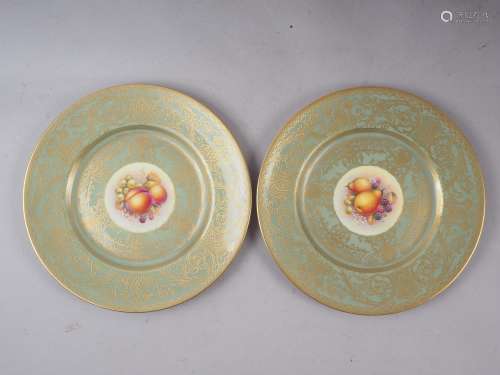A pair of Royal Worcester cabinet plates with celadon glazed...