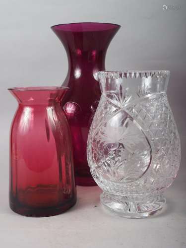 A purple glass baluster vase, 13 1/4 high, a cranberry glass...