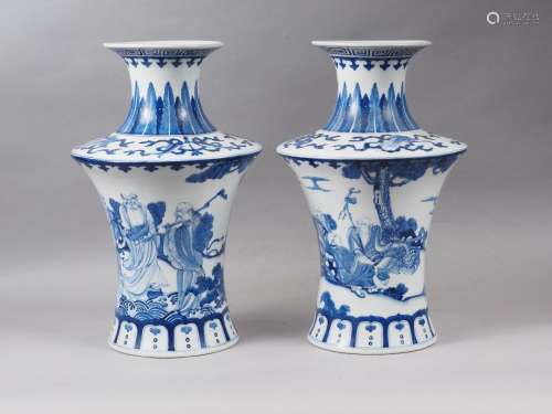 A pair of Chinese blue and white flared vases with figures i...