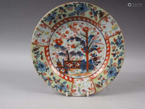 A Chinese polychrome plate with tree and fence design, 9 1/4...