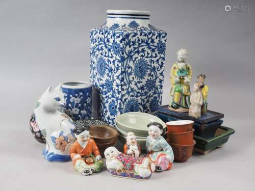 A quantity of mostly Chinese figures, a blue and white brush...