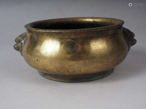 A Chinese brass coloured bronze censor with handles and four...