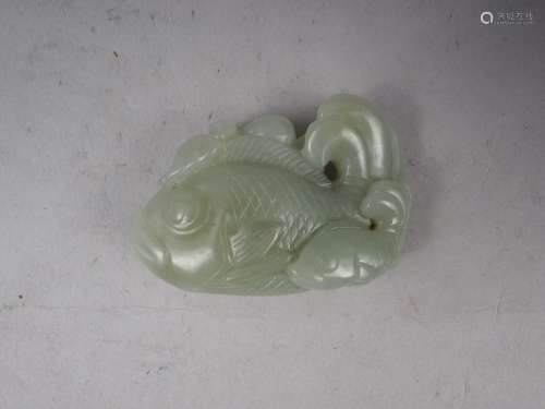 A Chinese carved jade fish, 2 1/2 wide