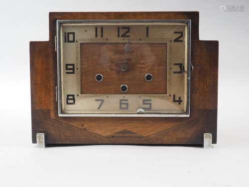 An Art Deco walnut cased mantel clock with three train movem...