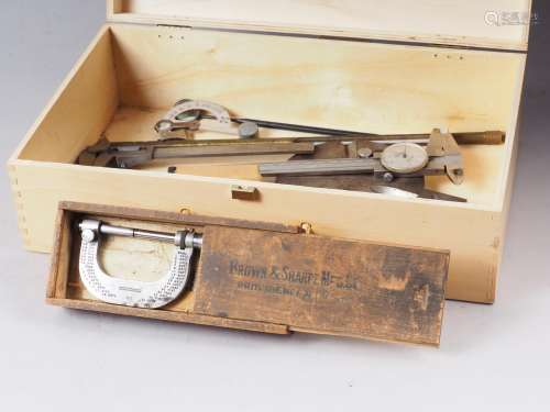 A Mitutoyo vernier gauge, two other gauges, a micrometer, a ...