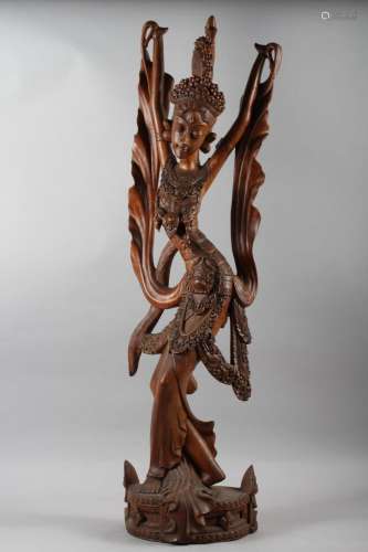 A Balinese carved hardwood figure of a dancer, 39 high