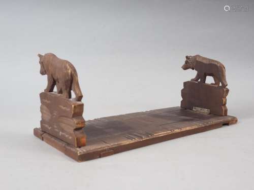 A Black Forest carved wood book slide with bear ends, 13 wid...
