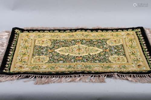 A Persian Zardozi mat, embellished with precious stones and ...