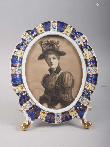 A Continental porcelain framed sepia print of a woman, 11 hi...