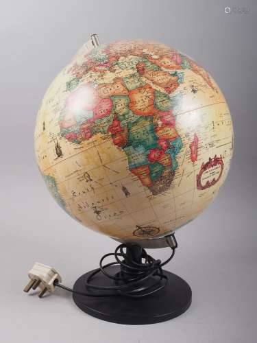 A contemporary revolving globe, on black plastic stand, 16 h...
