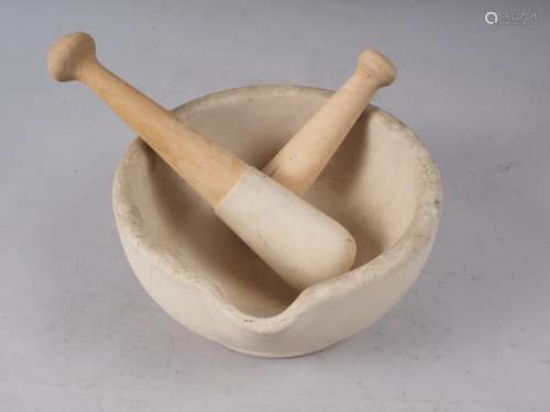 A stone pestle and mortar, 8 1/4 dia, a matching pestle and ...