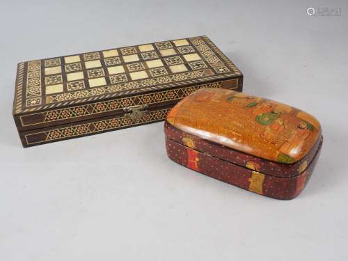 A parquetry and mother-of-pearl chess and backgammon board w...