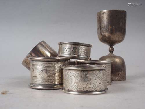 Five silver napkin rings, various, a brushed steel napkin ri...